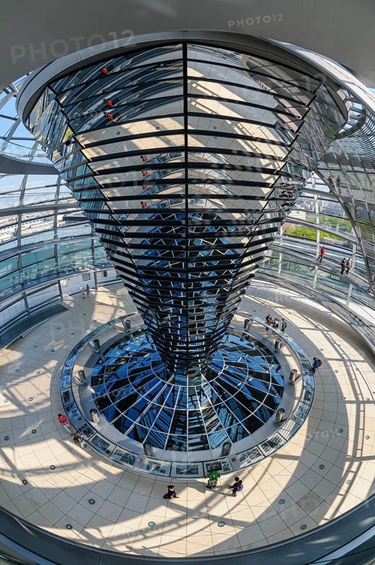 Interior view with fisheye effect of the glass dome of the Reichstag building with the cone-shaped light deflection element, which is equipped with 360 individual mirrors. These channel natural daylight into the plenary hall below, Berlin, Germany
