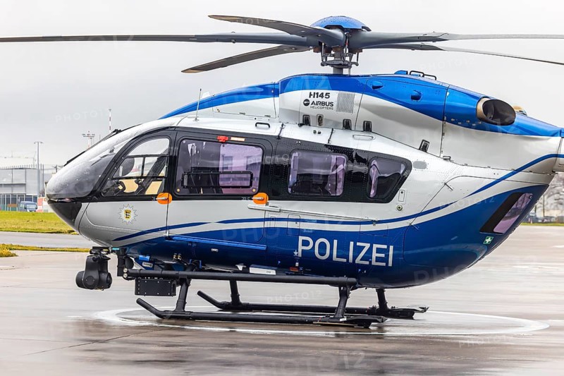 Helicopter from the Baden-Württemberg Police team in front of the hangar at the airport. Airbus Helicopters H145. Stuttgart, Baden-Württemberg, Germany