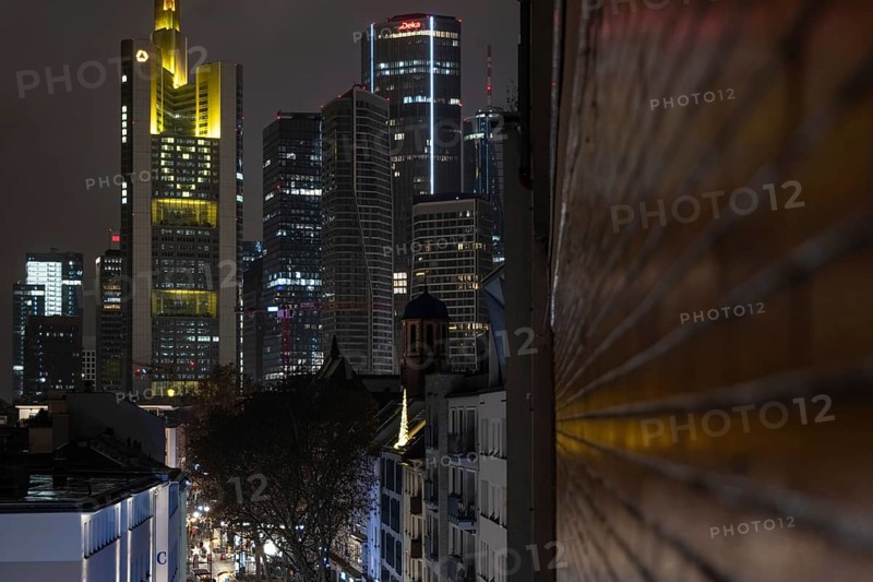 A yellow heart glows on the façade of the Commerzbank Tower in Frankfurt am Main at Christmas time in the evening, Frankfurt am Main, Hesse, Germany