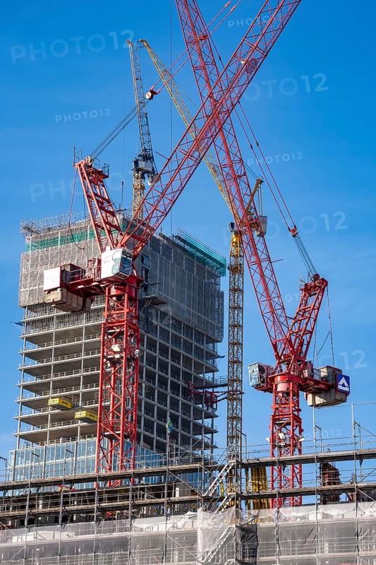 Construction site of the Covivio skyscraper in front, in the vicinity of Alexanderplatz in Berlin, mixed use of apartment, offices, retail and a daycare center, the high-rise construction site of The Berlinian office high-rise building in the back, Germany