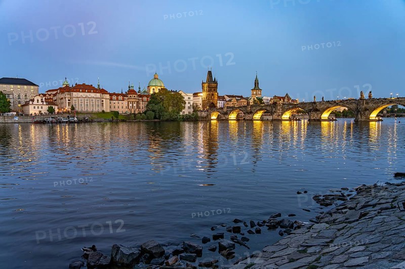 Old Town of Prague with Vltava River, Charles Bridge and Old Town Bridge Tower at dusk, Prague, Czech Republic