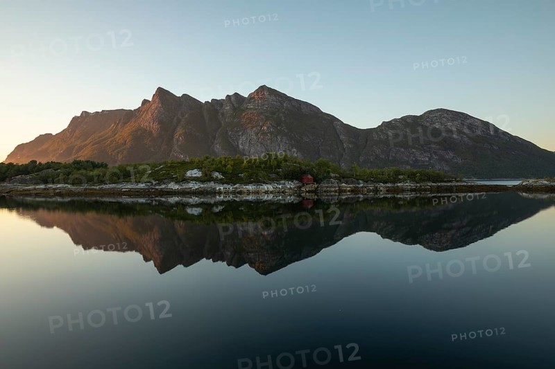 Sunset over Festvåg near Bodø. Reflection of mountains in the fjord