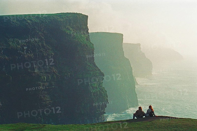 People on the edge of a cliff, there was no fence back then, Cliffs of Moher, County Clare, Republic of Ireland, April 9, 1995, vintage, retro, old, historic