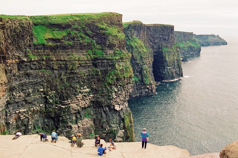 People on the cliff edge, there was no fence back then, Cliffs of Moher, County Clare, Republic of Ireland, July 21, 1993, vintage, retro, old, historic