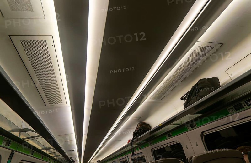 Pattern formed by stripes of ceiling lighting inside GWR InterCity Express train carriage, UK