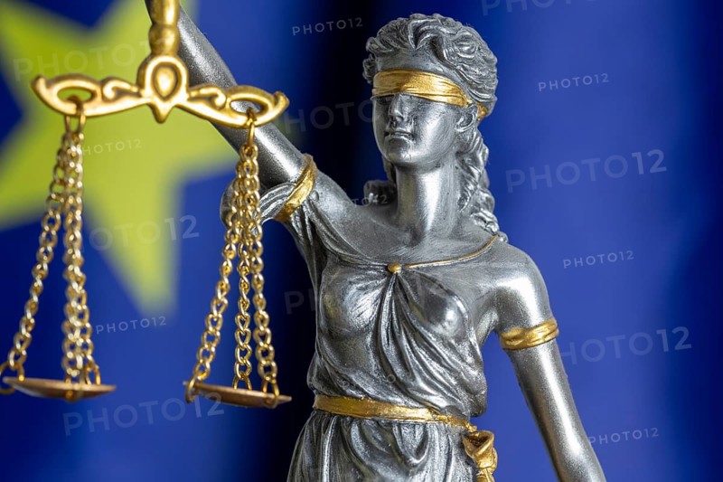 Close-up of justice in front of the flag of the European Union (symbolic image)