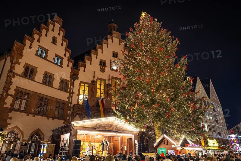 With the lighting on the Mrs. Holle Christmas tree, a 30-meter high Nordmann fir tree, the Frankfurt Christmas Market was officially opened on 24.11.2025. The Christmas market will be open until December 22 from Monday to Saturday from 10:00 to 21:00 and on Sundays from 11:00 to 21:00, Römerberg, Frankfurt am Main, Hesse, Germany