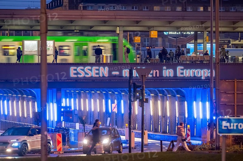 The main train station in Essen, blue-lit underpass, bus station, am Europaplatz, public transport train on the platform, North Rhine-Westphalia, Germany