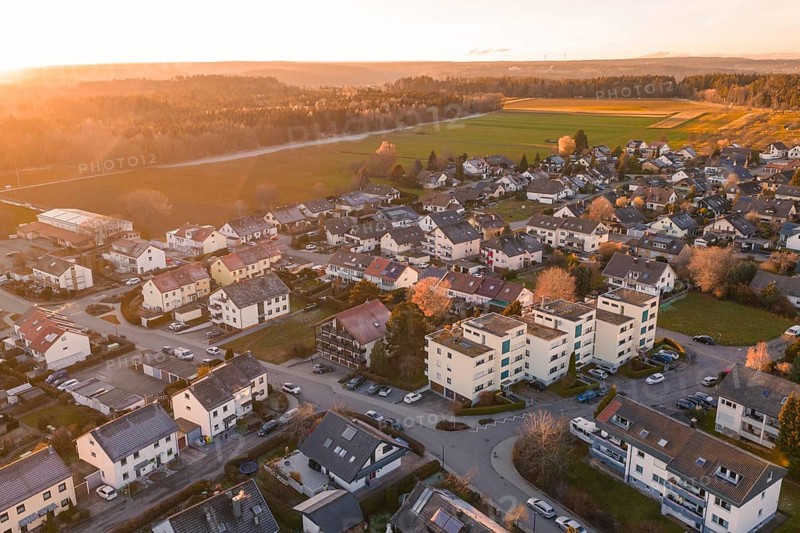 Aerial village with settlements and fields in evening autumn light, Althengstett, Calw district, Germany