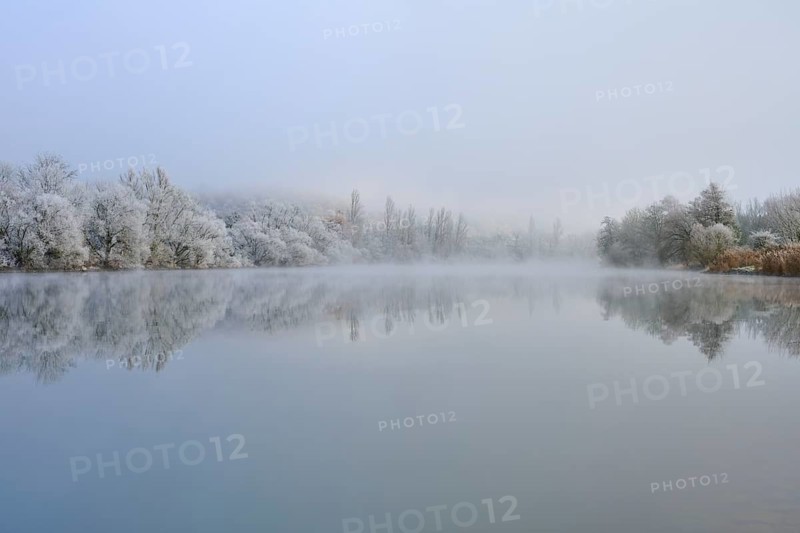 Foggy winter scenery with snow-covered trees reflected in a quiet river, hoarfrost, winter, Boxtal, Main-Tauber district, Baden-Württemberg, and Stadtprozelten, Dorfprozelten, Main, Spessart, Bavaria, Germany