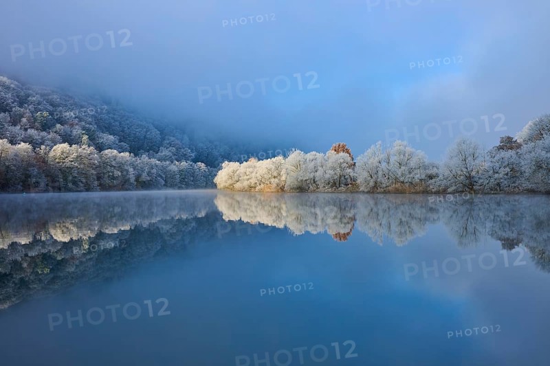 A calm river reflects frosty trees and mountains in a wintry environment, hoarfrost, winter, Boxtal, Main-Tauber district, Baden-Württemberg, and Stadtprozelten, Dorfprozelten, Main, Spessart, Bavaria, Germany