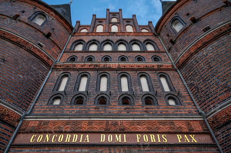 Concodia Domini Fotris Pax: The harmony of the Lord, the peace of the father, a saying at the Holsten Gate, historic city gate from 1478, Holstentorplatz, Hanseatic City of Lübeck, Schleswig-Holstein, Germany