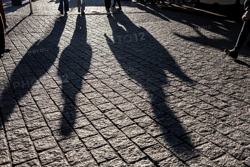 Shadows of people on the ground, low sun, winter, silhouettes, Germany
