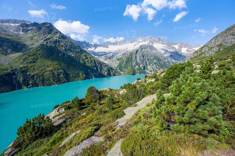 Turquoise blue mountain lake Göscheneralpsee, picturesque mountain landscape with dammastock and damma glacier, Göscheneralp, Canton of Uri, Switzerland