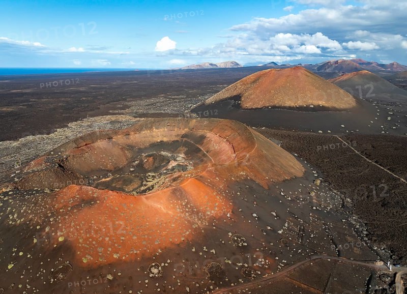Montaña Quemada and Montaña Pedro Perico volcanoes, volcanic landscape with craters and lava fields, aerial view, Lanzarote, Canary Islands, Spain