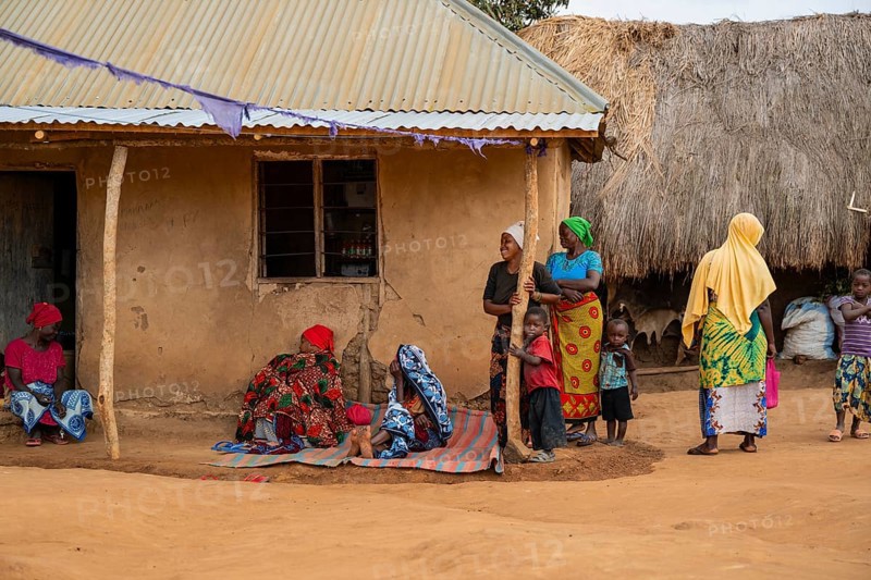 Villagers in a traditional village, mud huts, Sadaani, Tanzania