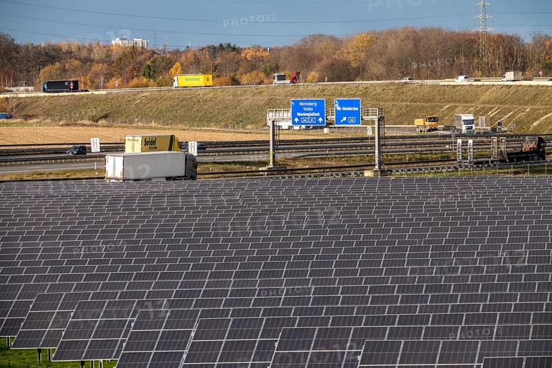 86.5 MW peak open-air photovoltaic systems, from RWE, with over 141, 000 solar modules, on a side strip, along the A44 motorway near Jüchen, at Dreieck Holz, recultivated open-cast mining site, North Rhine-Westphalia, Germany