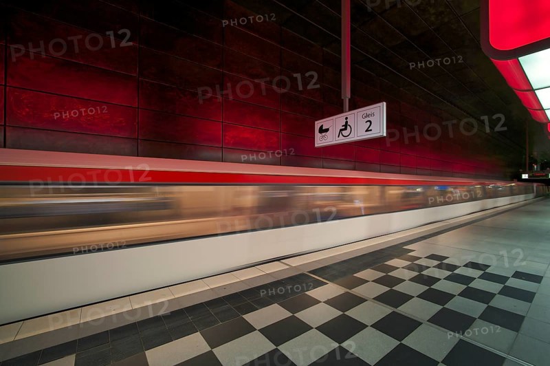 HafenCity University underground station, illuminated in color, red, underground train, movement effect, U4, empty, platform, stop, train station, subway, sign, boarding area wheelchair user, stroller, public transport, HVV, Hamburger Verkehrsverbund, Hochbahn, public transport, Free and Hanseatic City of Hamburg, Germany