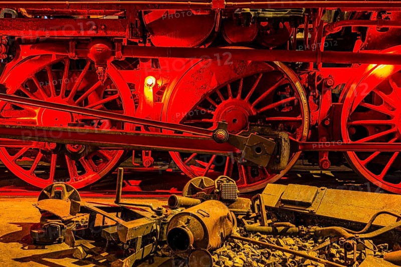 Illuminated wheelwork of a historic locomotive, railway museum, Augsburg railway park, administrative district of Swabia, Bavaria, Germany