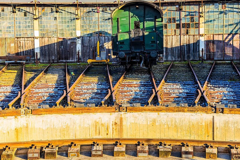 Historic railroad car parked in front of the old engine shed, Augsburg railway park, administrative district of Swabia, Bavaria, Germany