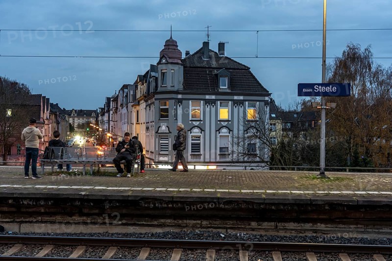 Essen-Steele S-Bahn station, passengers waiting for the train late afternoon, in autumn, Essen, North Rhine-Westphalia, Germany