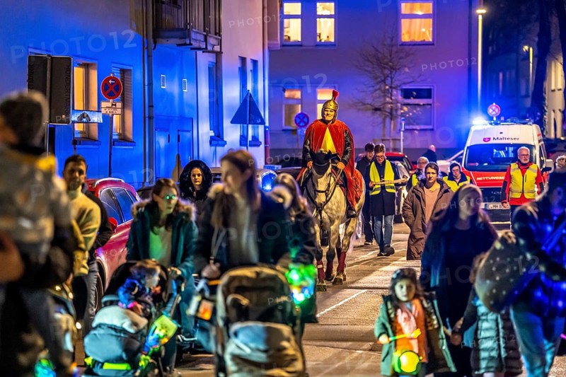 Safety at the Martin train in Essen-Rüttenscheid, the parish of St. Lambertus, accompanied by police and rescue services, Saint Martin performer on a horse, with over 500 participants, North Rhine-Westphalia, Germany