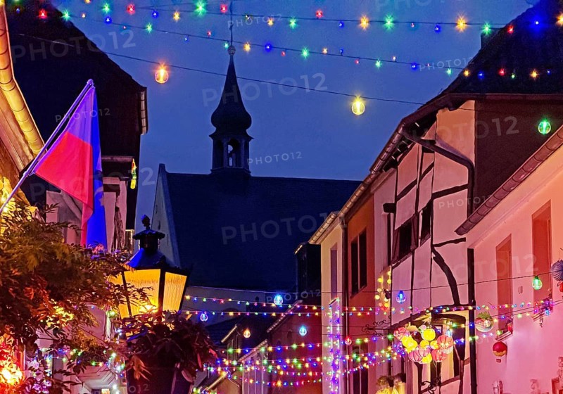 Tastefully decorated Tiefstraße in the evening with St. Peter's Church, Kempen, Lower Rhine, North Rhine-Westphalia, Germany