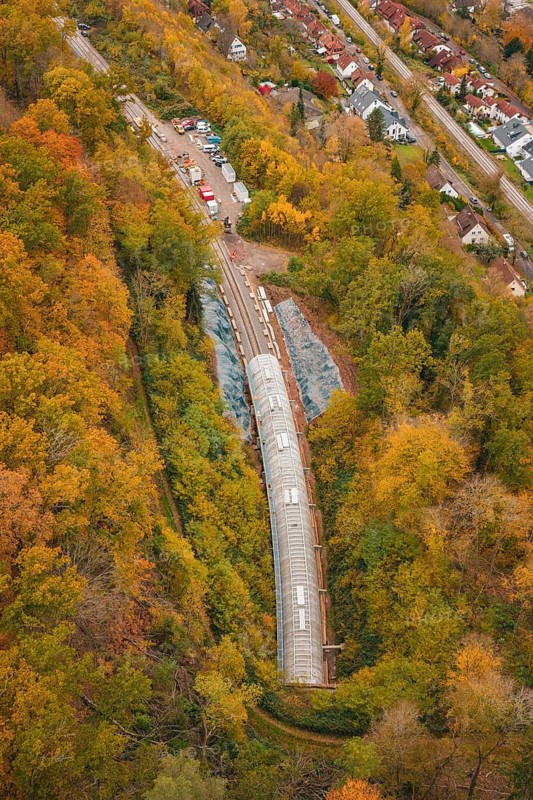Autumn forest surrounds the construction site of a railway tunnel under construction, Hermann-Hesse-Bahn construction site, Calw, Germany