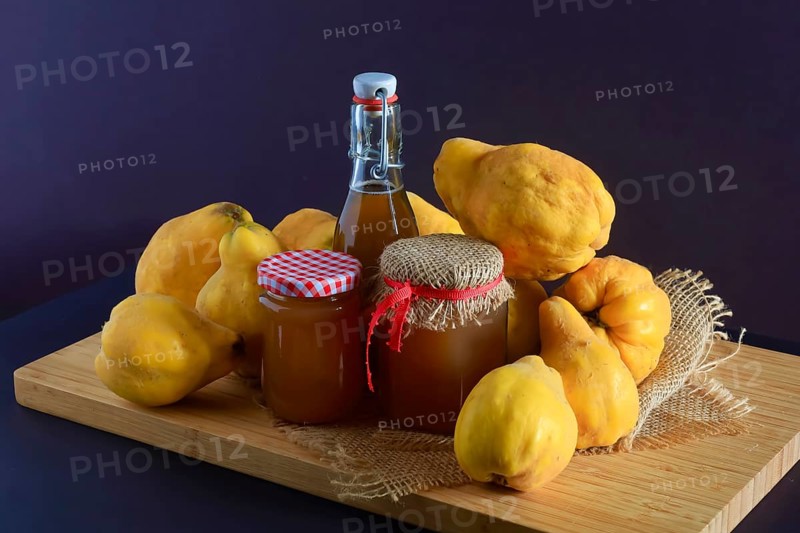 Still life with quinces, homemade quince jelly and quince liqueur, autumn, Germany