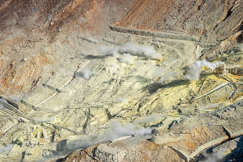 Steaming fumaroles in the Owakudani geothermal area at Komagatake volcano, Hakone, Japan