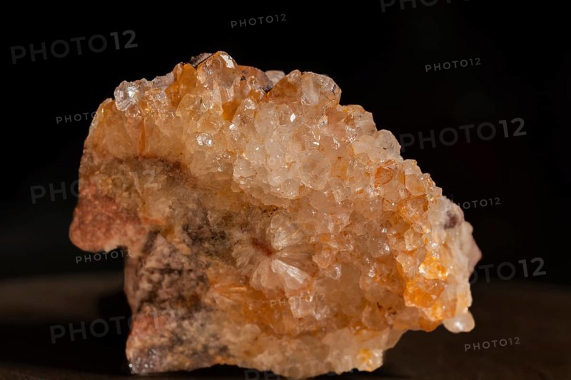 Quartz soil with sparkling crystals that are exposed on a grey surface. The lighting highlights the facets and reflections of the stones. Bas Rhin, Alsace, France