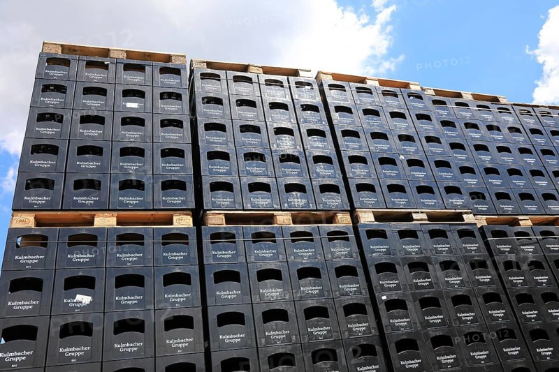 Stacked black beer crates from the Kulmbacher Group, a beverage manufacturer that includes Kulmbacher Brauerei AG and other breweries such as Sternquell, Braustolz and Würzburger Hofbräu, editorial