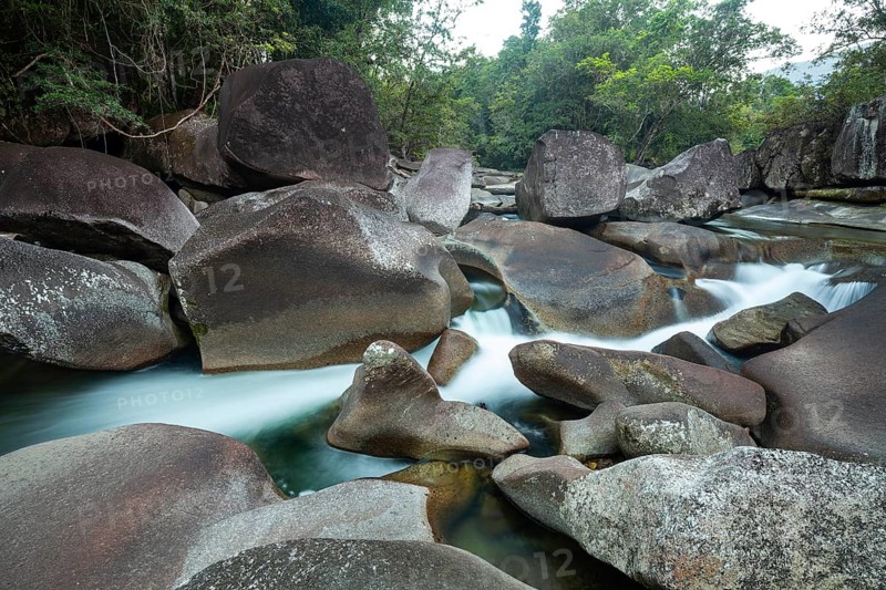 Turquoise blue water between rocks in the tropical rainforest of Babinda Boulders Queensland Australia