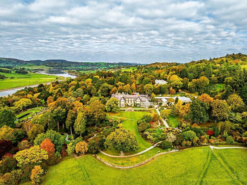 Autumn colours over Bodnant House and Garden from a drone, Conwy River, Colwyn Bay, Conwy, Wales, England, United Kingdom
