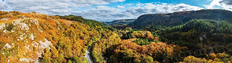 Autumn colours over Gwydir Forest Park from a drone, Afon Lledr, Road A470, Snowdonia, Eryri, Wales, England, United Kingdom