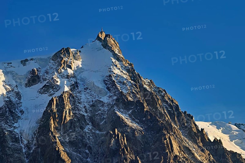 Snowy Aiguille du Midi in the evening light, Mont-Blanc, Chamonix-Mont-Blanc, Haute-Savoie, France