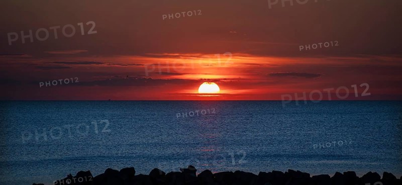 Sunset on the Baltic Sea with protective breakwaters, Darß, Ahrenshoop, Mecklenburg-Western Pomerania, Germany