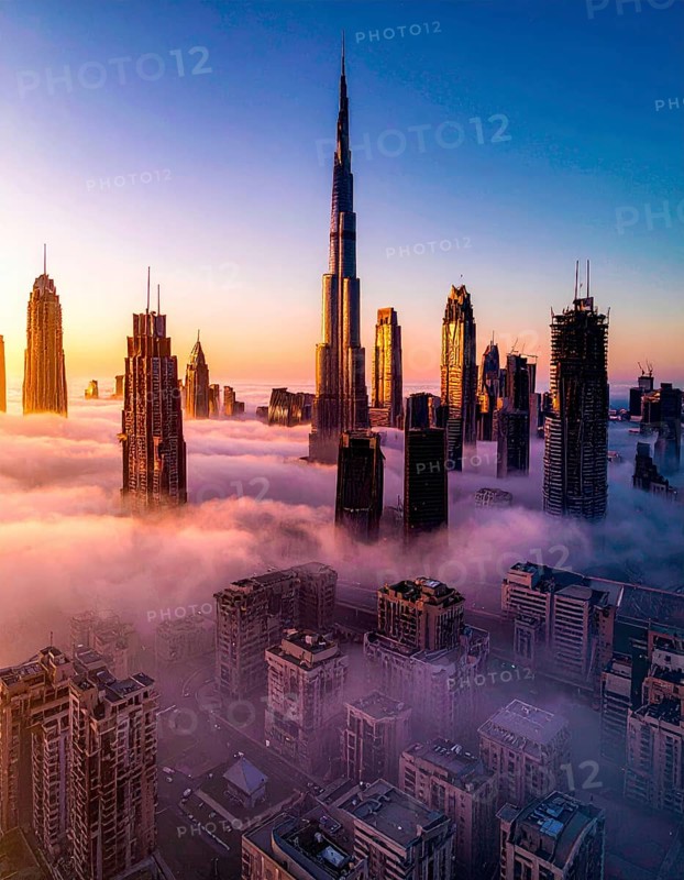 City scape emerging from a dense enveloping fog in sunrise and skyscrapers piercing the haze, big metropolis with skyline, mist on ground, blue sky, city in an aerial view, AI generated