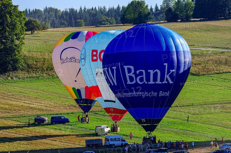 Hot air balloons are being prepared for takeoff as part of an air show at the Fliegerbergfest of the Rossfeld Luftsportverein in Metzingen-Glems, Baden-Württemberg, Germany, for editorial use only