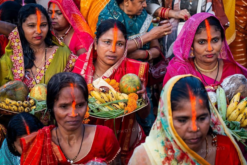 Hindu devotees offer prayers to the Sun God on the bank of Brahmaputra river on the occasion of Chhath Puja, in Guwahati, India on 27 October 2025
