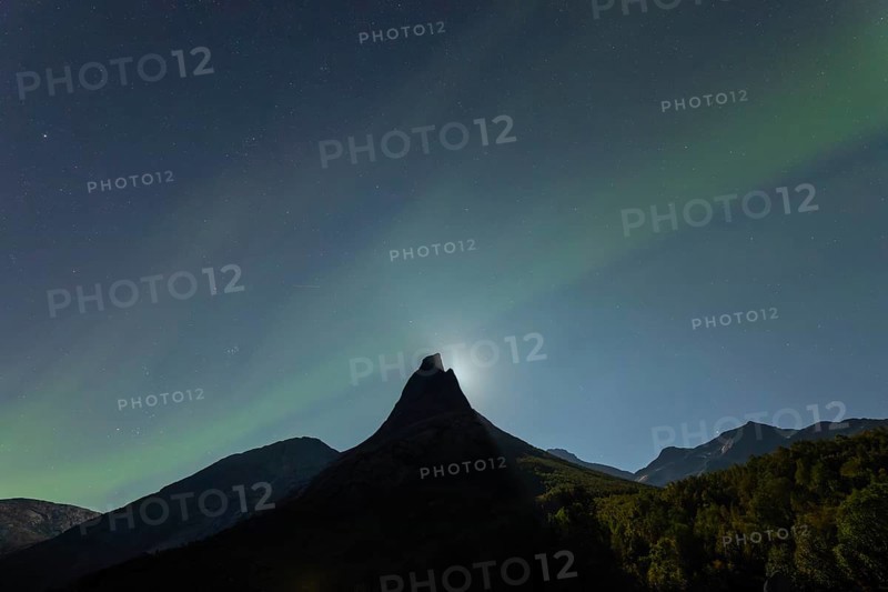 National mountain of Norway - Stetind in the Nordland under auroras and a full moon