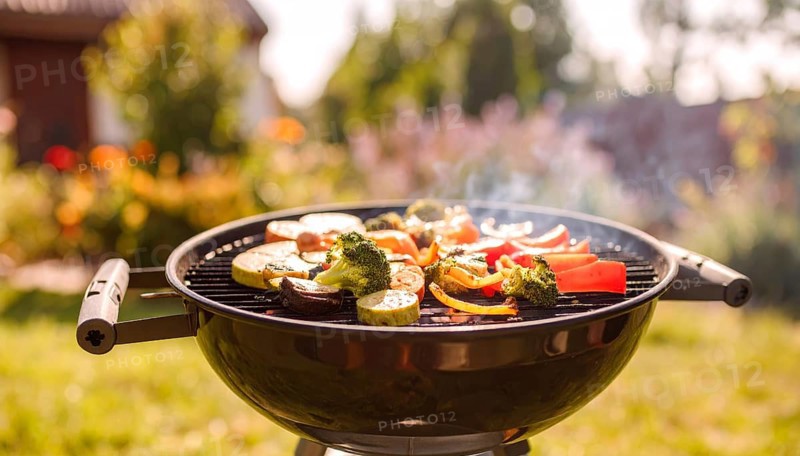 Cooking vegetables on grill outdoors, healthy lifestyle with healthy food, close up of grill with blurred background, soft golden light, picnic in the green park or garden, no people, AI generated