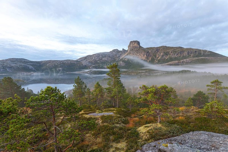 Magical morning fog on Steigtindvatnet in front of the majestic Steigtinden in Norway near Bodø