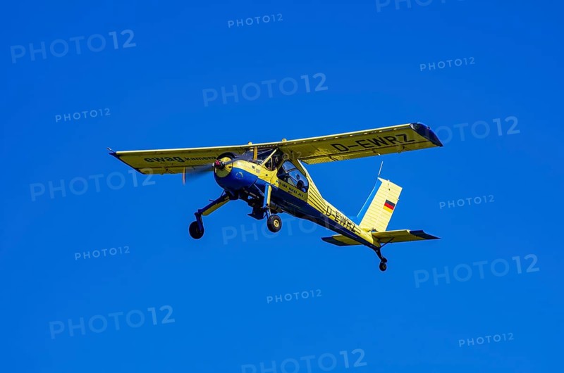 A PZL-104 Wilga-35A sport aircraft from Fliegerklub Kamenz with registration D-EWRZ during a flight demonstration as part of an air show on Rossfeld in Metzingen-Glems, Baden-Württemberg, Germany, for editorial use only