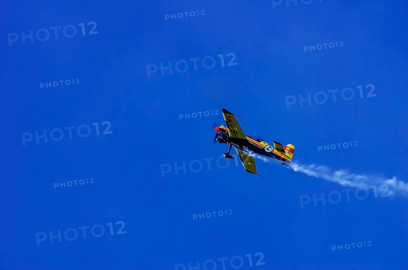 A Votec 351 sport aircraft from the Swiss MSW Aviation AG with registration HB-YMV during a flight demonstration as part of an air show on Rossfeld in Metzingen-Glems, Baden-Württemberg, Germany, for editorial use only