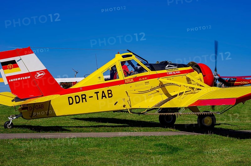 A PZL-106 AR Kruk agricultural aircraft with the registration D-FOAB and the original registration DDR-TAB as well as in the original colors of the company Agrarflug of Interflug as part of an air show on Rossfeld in Metzingen-Glems, Baden-Württemberg, Germany, for editorial use only