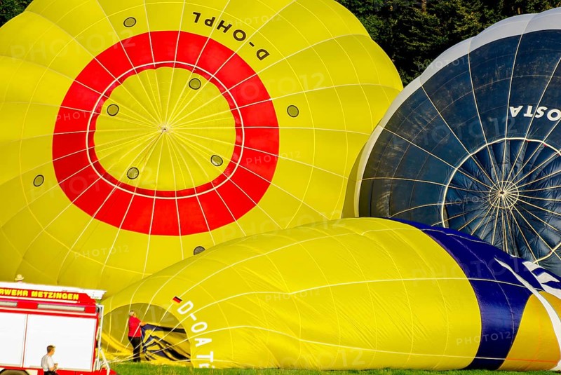 Hot air balloons being prepared for take-off as part of an air show at the Rossfeld in Metzingen-Glems, Baden-Württemberg, Germany, for editorial use only