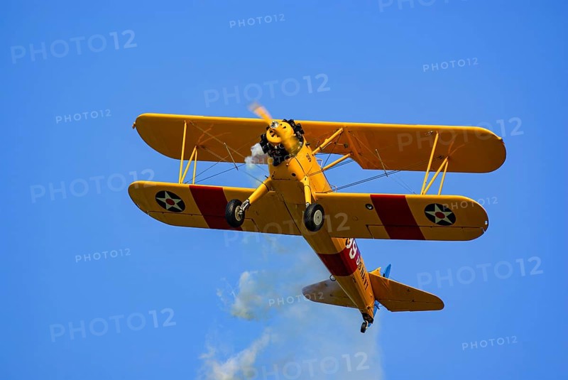 A Boeing-Stearman biplane during a flight demonstration as part of an air show at the Rossfeld in Metzingen-Glems, Baden-Württemberg, Germany, for editorial use only