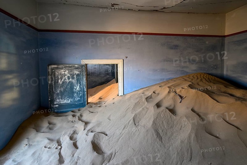 Sand mountains in a former dwelling house, interior photograph, Kolmanskop, restricted diamond area, near Lüderitz, Karas region, Namibia