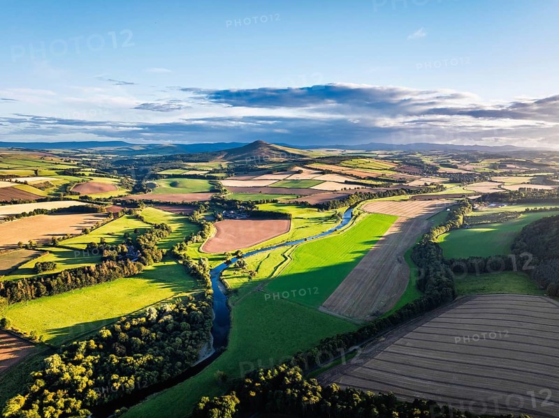 Fields and Farms over River Teviot and Minto Crags from a drone, Roxburghshire, Scottish Borders, Scotland, UK